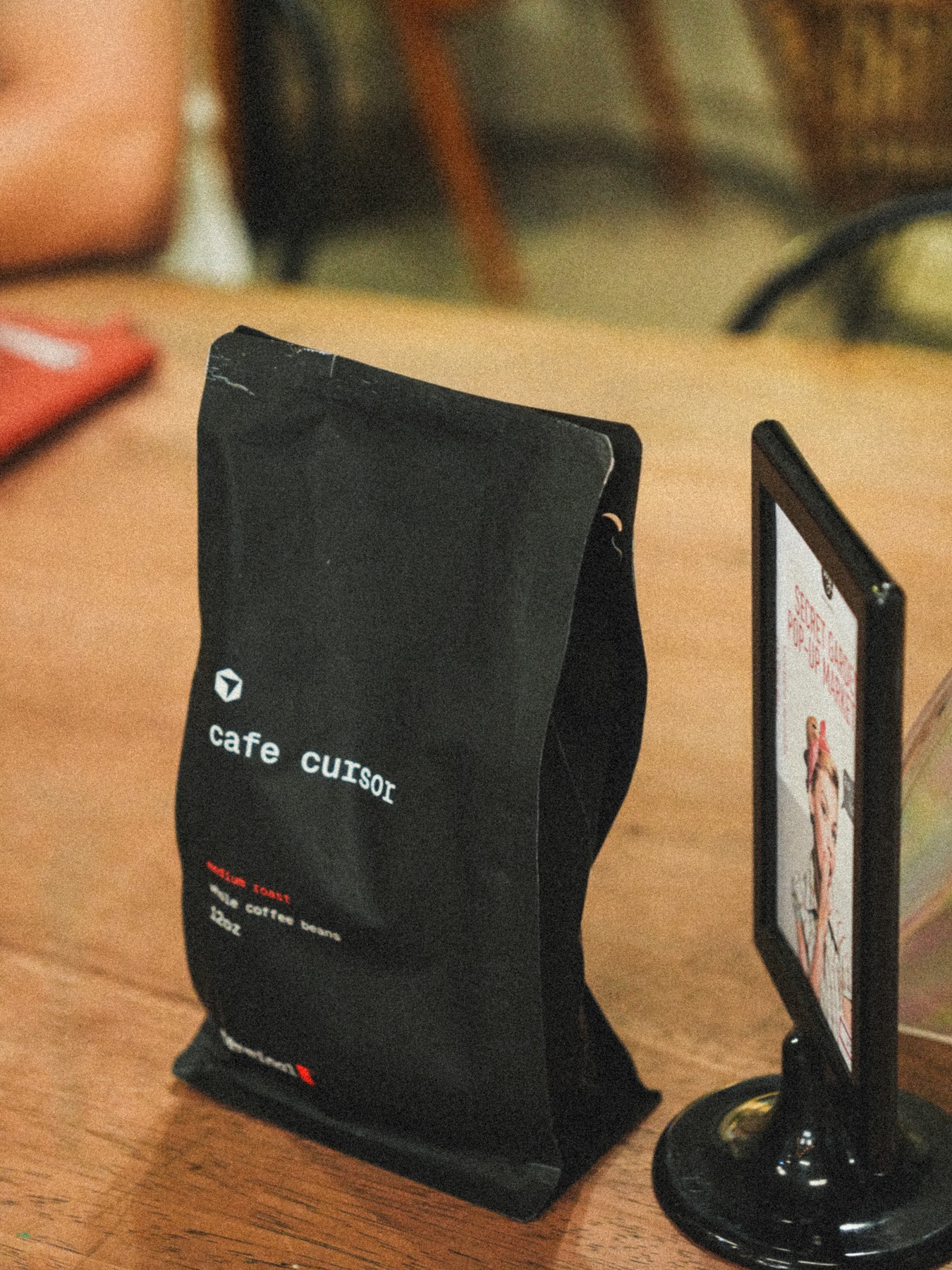 Cafe Cursor Dubai swag bag on a table