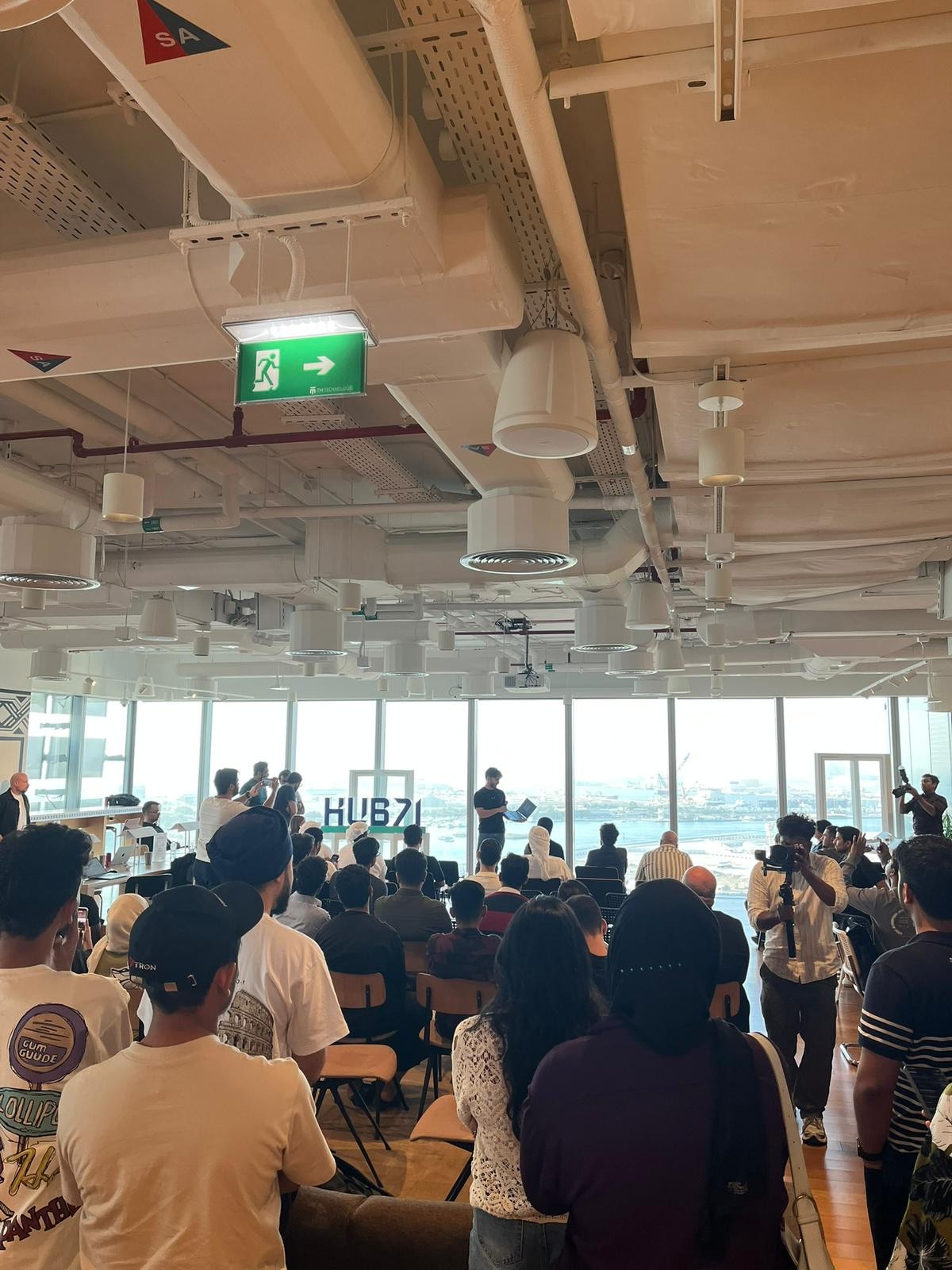 Hackathon participants gathered for a Hub71 session