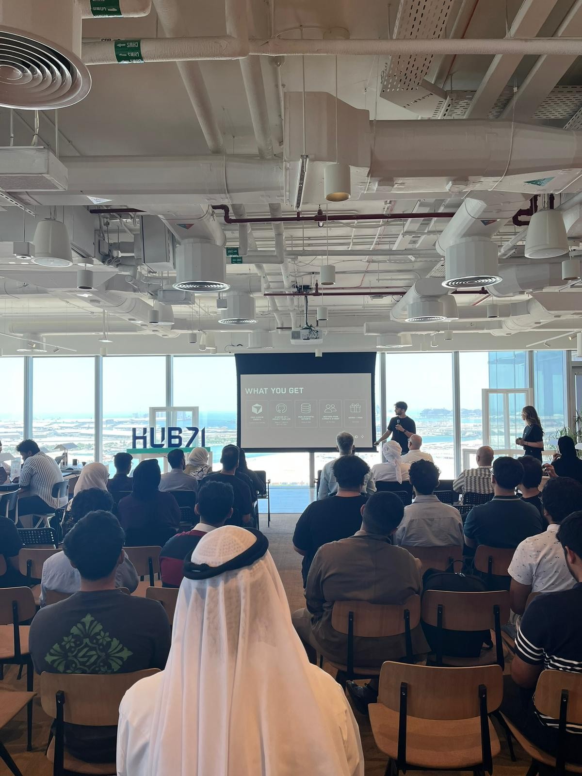 Hackathon room during a presentation at Hub71
